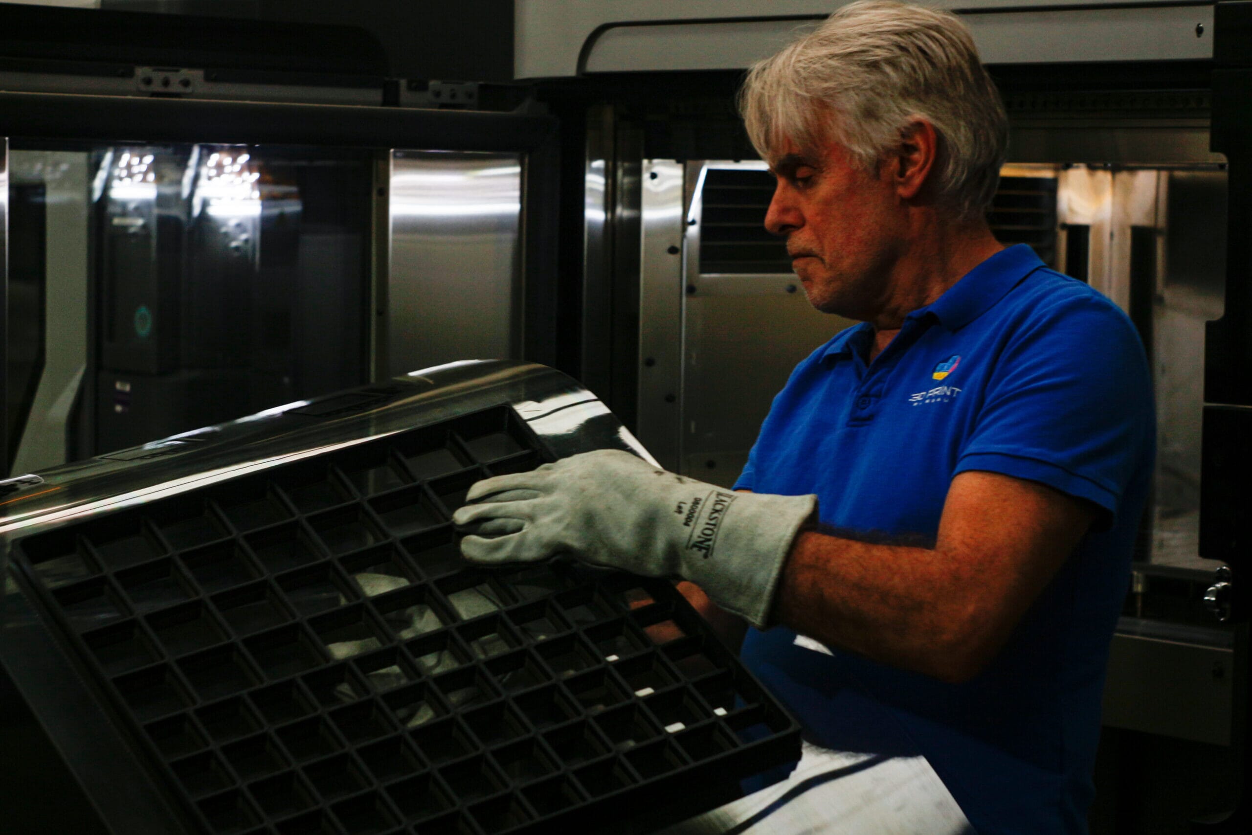 person in front of fortus 450mc printer
