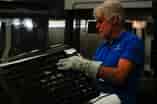 person in front of fortus 450mc printer